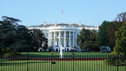 The US Capitol with barriers and closed signage in the foreground.