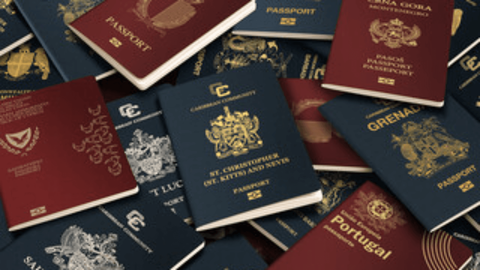 A pile of international passports with red and blue covers and gold emblems